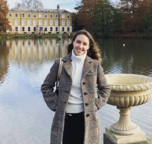 Isabella standing in front of a lake